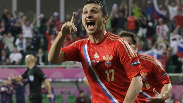Russia's Alan Dzagoev celebrates one of his two goals